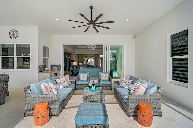 view of patio with ceiling fan and outdoor lounge area