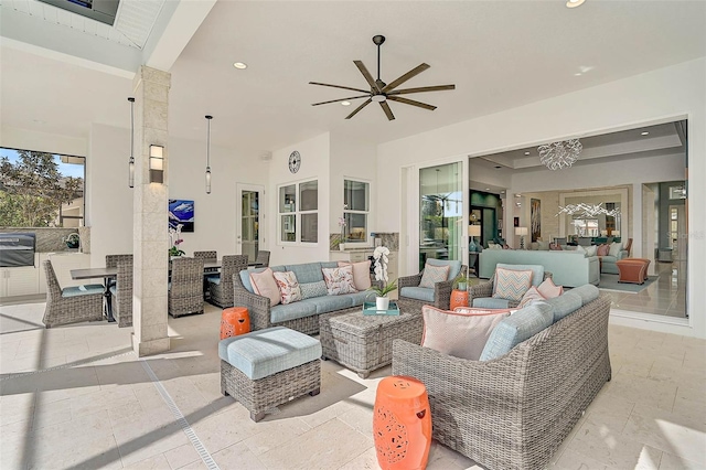 view of patio featuring outdoor dining area, outdoor lounge area, and a ceiling fan