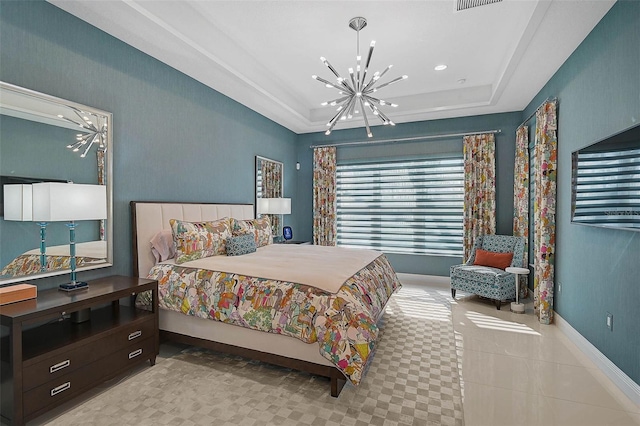 bedroom with a tray ceiling, visible vents, a notable chandelier, and baseboards