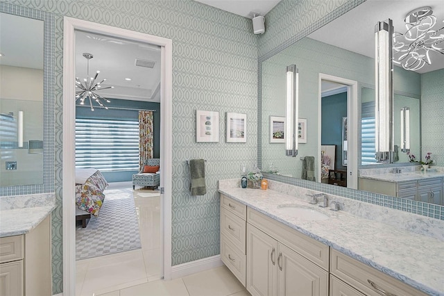 ensuite bathroom featuring a sink, tile patterned flooring, ensuite bath, and wallpapered walls