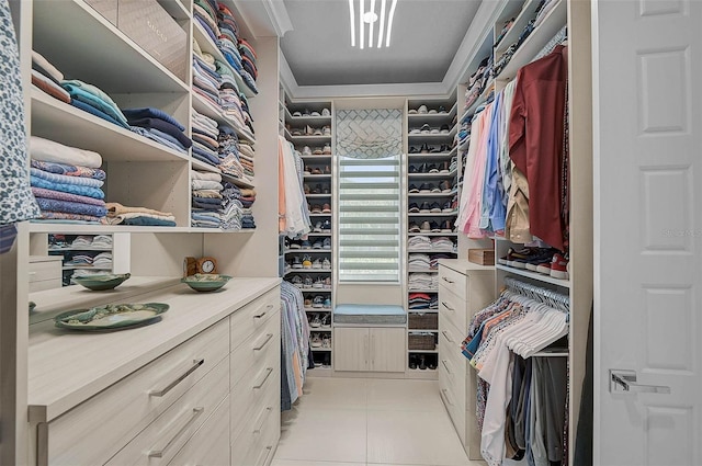 spacious closet featuring light tile patterned floors