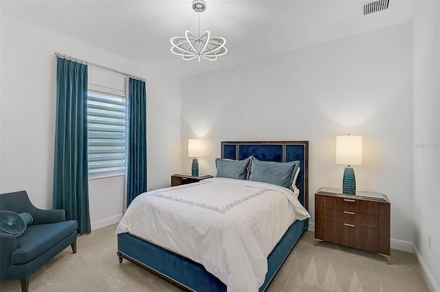 bedroom with baseboards, a chandelier, visible vents, and light colored carpet