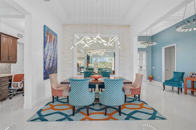 dining space with french doors, light tile patterned flooring, visible vents, and baseboards