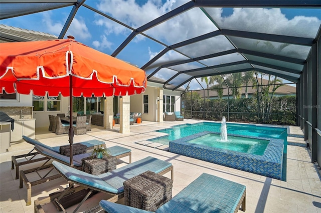 view of pool with a pool with connected hot tub, glass enclosure, a patio, and an outdoor hangout area