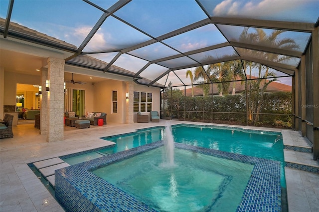 view of pool featuring a ceiling fan, a lanai, a patio, and an outdoor living space