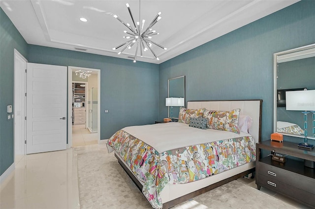 bedroom with a tray ceiling, light tile patterned flooring, and a notable chandelier