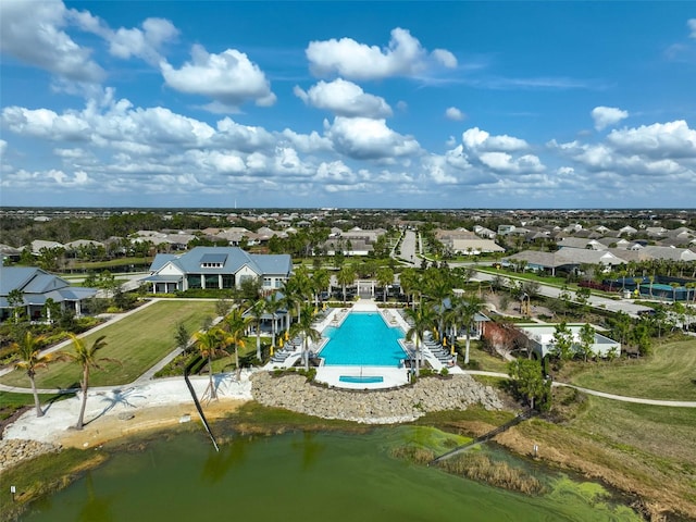 bird's eye view with a water view and a residential view