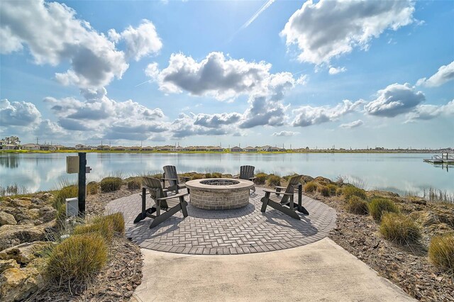 8261 Grande Shores Dr, Sarasota, FL 34240 - view of patio featuring an outdoor fire pit and a water view