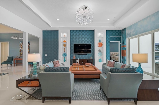 8261 Grande Shores Dr, Sarasota, FL 34240 - living area with a tray ceiling, a chandelier, and built in shelves