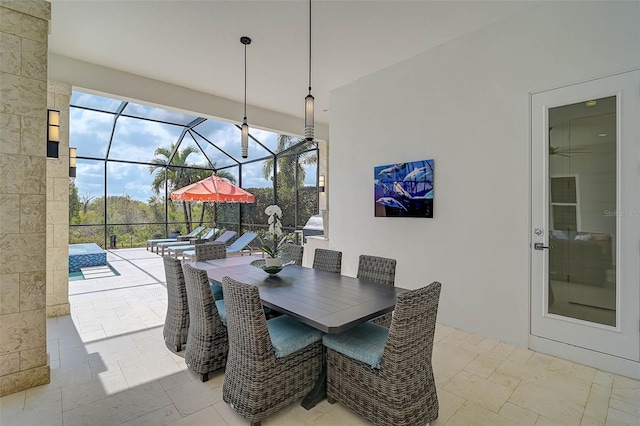 8261 Grande Shores Dr, Sarasota, FL 34240 - dining room featuring a sunroom and stone tile floors