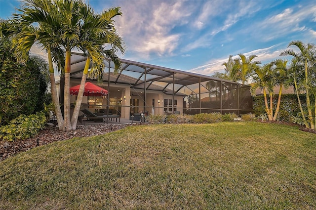 8261 Grande Shores Dr, Sarasota, FL 34240 - view of green lawn featuring a patio area and a lanai