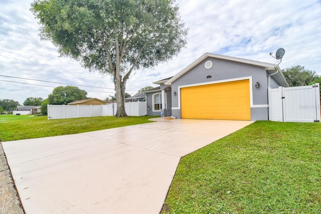 view of front of property with a garage and a front lawn