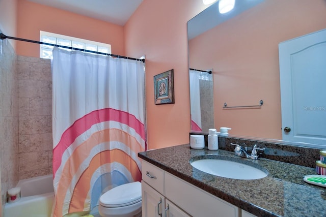 full bathroom with toilet, vanity, and shower / tub combo with curtain