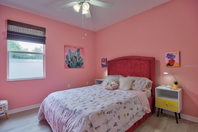 bedroom with light wood-type flooring and ceiling fan