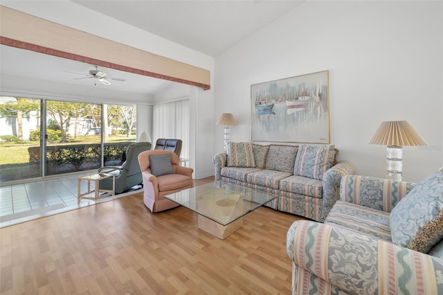 living room with ceiling fan and light hardwood / wood-style flooring