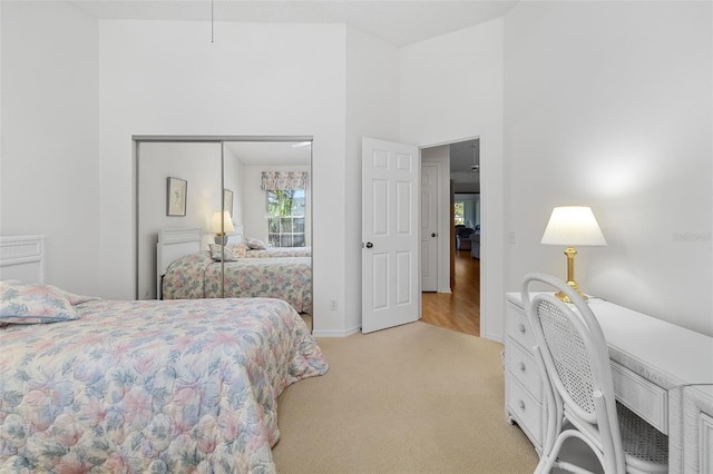 carpeted bedroom featuring a closet