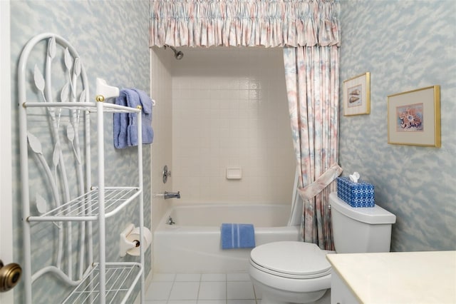 full bathroom featuring tile patterned flooring, vanity, shower / bath combo with shower curtain, and toilet