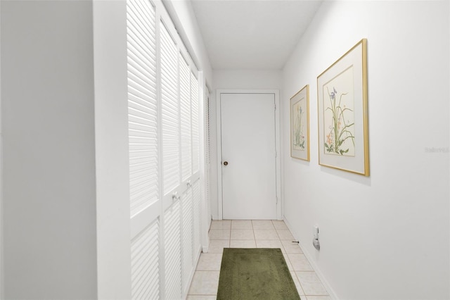 corridor with light tile patterned flooring