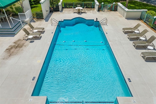 view of swimming pool featuring a patio