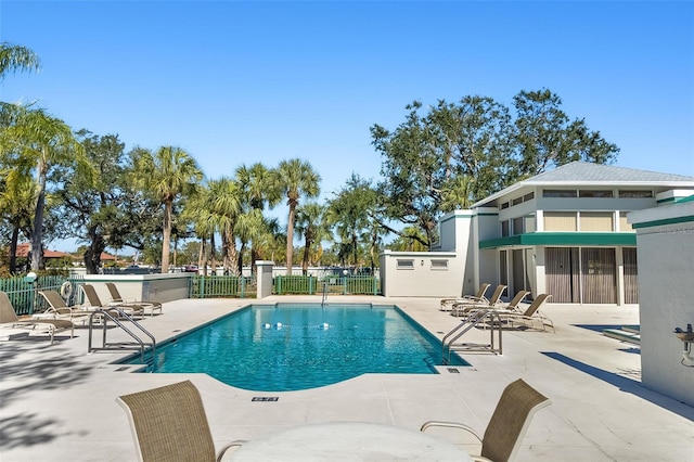 view of swimming pool featuring a patio