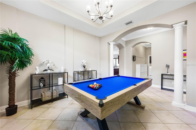 rec room featuring decorative columns, light tile patterned floors, and a tray ceiling