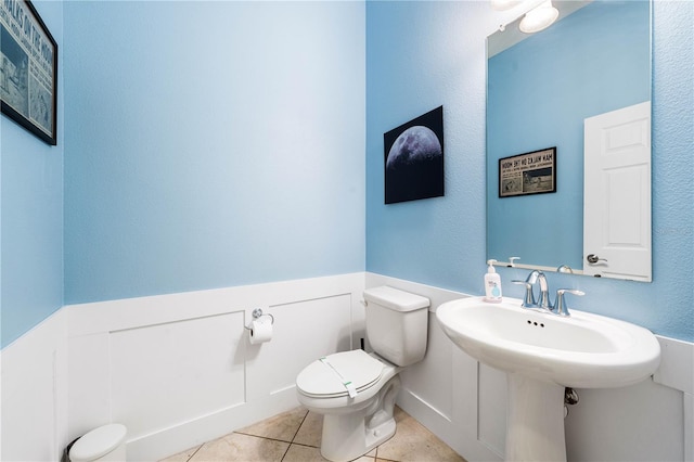 bathroom featuring tile patterned floors and toilet