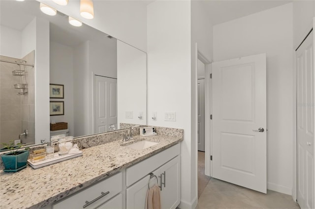 bathroom featuring tile patterned floors and vanity