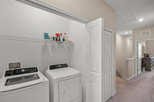 clothes washing area featuring washer and clothes dryer