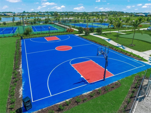 view of basketball court featuring a water view and tennis court