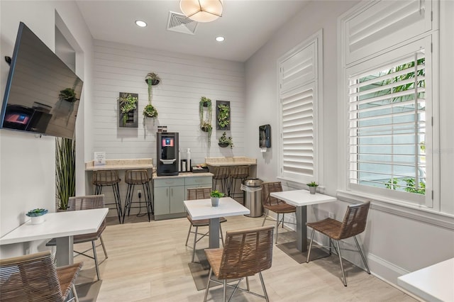 living area featuring light hardwood / wood-style flooring and plenty of natural light