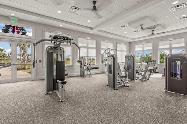 exercise room featuring carpet, a drop ceiling, ceiling fan, and french doors