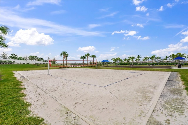 view of basketball court featuring volleyball court and a lawn