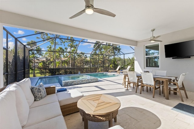 view of pool featuring glass enclosure, a patio area, an outdoor hangout area, and ceiling fan