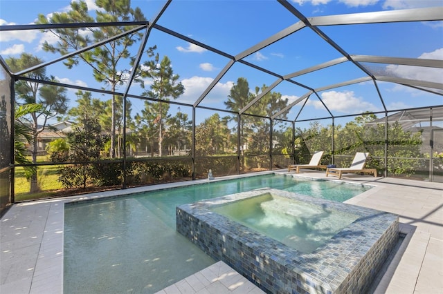 view of swimming pool with an in ground hot tub, a lanai, and a patio