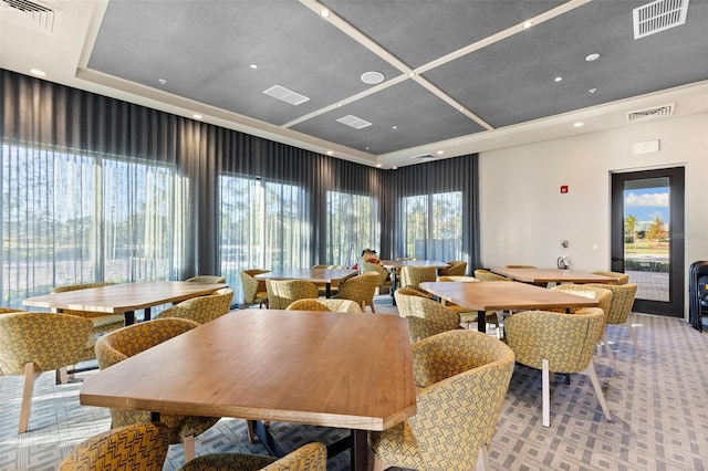 dining room with a raised ceiling