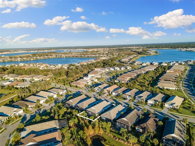 drone / aerial view with a water view