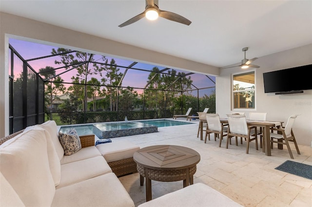 exterior space with an outdoor living space, ceiling fan, and glass enclosure