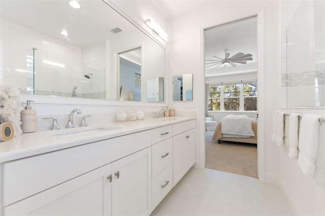 bathroom featuring a shower, vanity, and ceiling fan