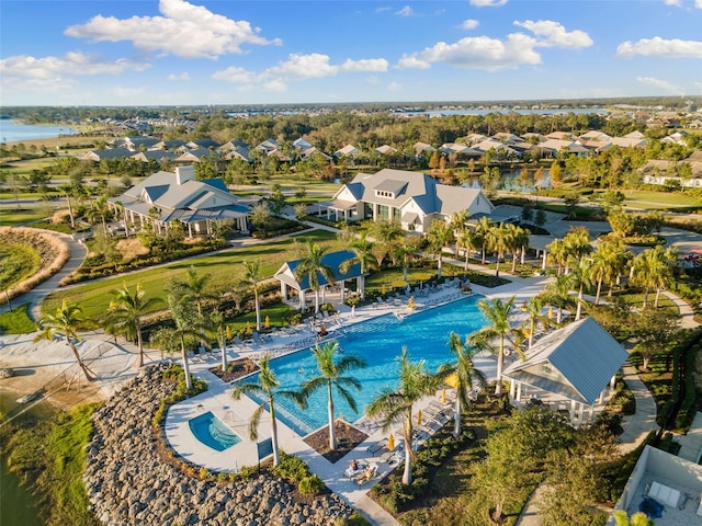 birds eye view of property with a water view