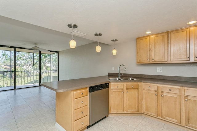 kitchen with hanging light fixtures, stainless steel dishwasher, sink, expansive windows, and kitchen peninsula