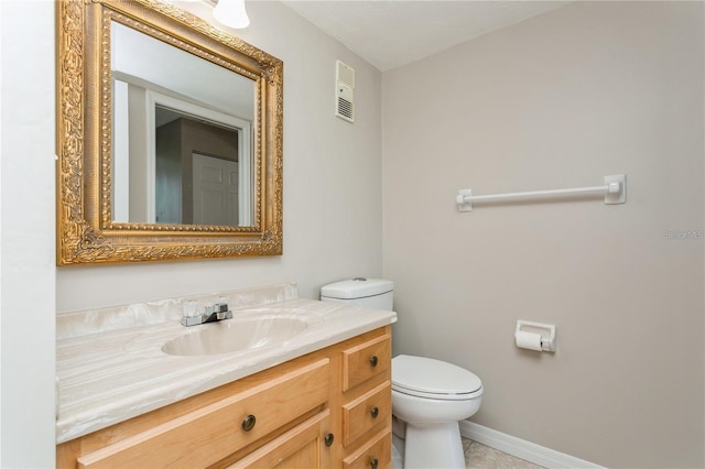 bathroom featuring toilet and vanity