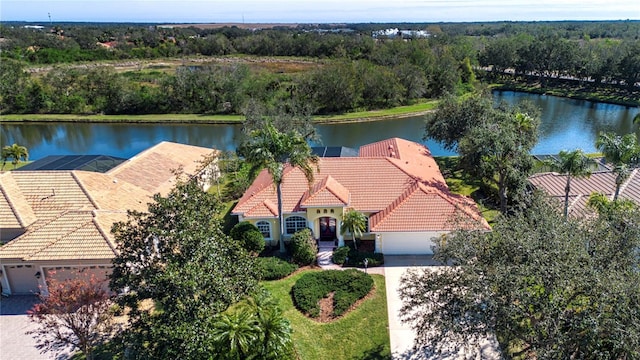 birds eye view of property featuring a water view