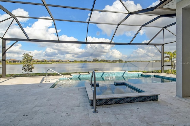 view of swimming pool with a patio area, an in ground hot tub, a water view, and glass enclosure