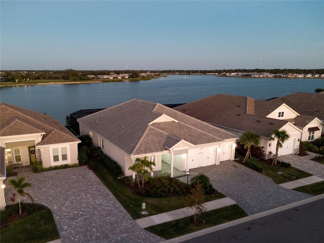 aerial view at dusk with a water view