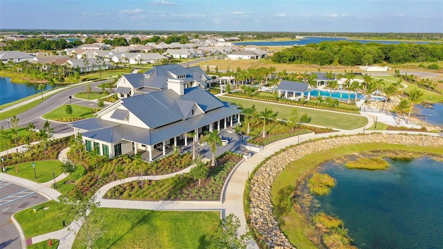 birds eye view of property with a water view