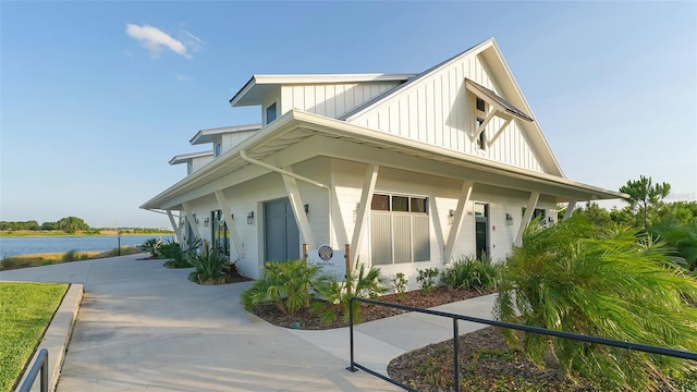 view of property exterior with a water view