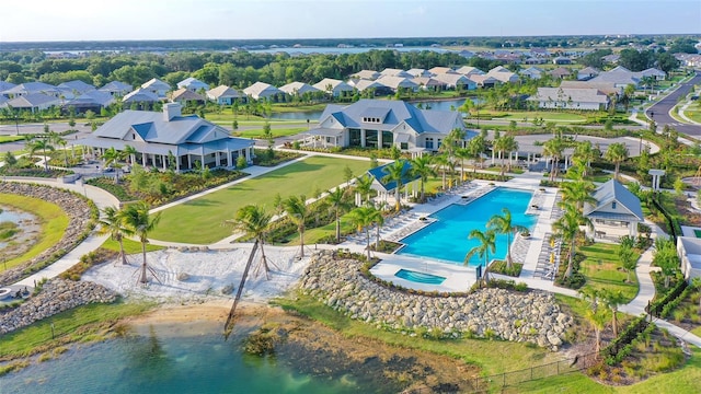 birds eye view of property with a water view