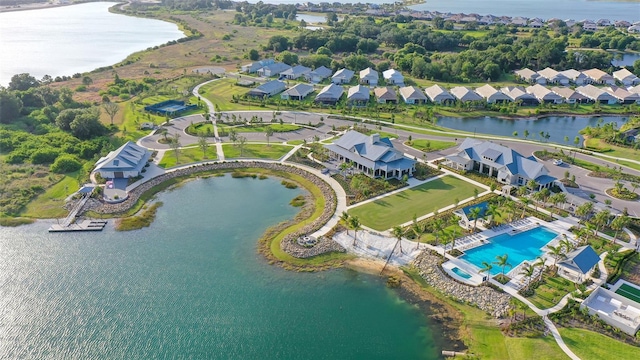 birds eye view of property with a water view