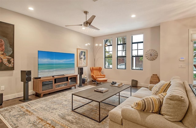 living room featuring hardwood / wood-style flooring and ceiling fan