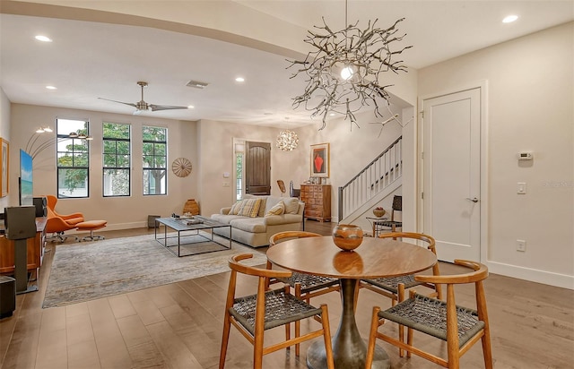 dining space featuring hardwood / wood-style flooring and ceiling fan